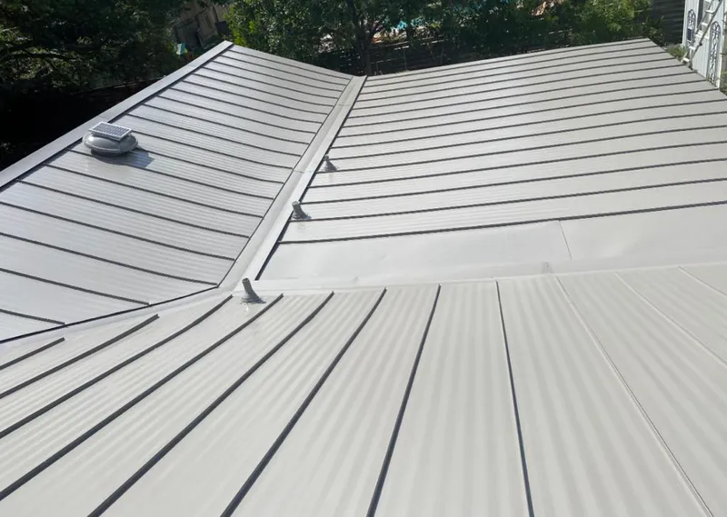 Solar attic fan installed on a metal roof for Roof Ventilation in Piedmont